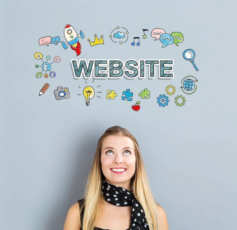 Website concept with happy young woman on a gray background